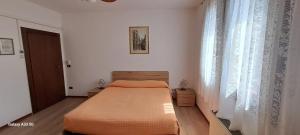 a small bedroom with a bed and a window at La Pioppa Agriturismo in Sacile +38 photos