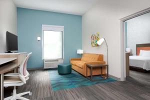 Home2 Suites By Hilton Clermont客房内的一张或多张床位