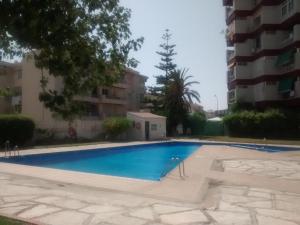 a swimming pool in the middle of a building at El balconcito al mar in Nerja