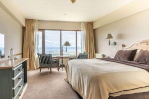 Cama ou camas em um quarto em Wyndham Garden Ushuaia Hotel del Glaciar