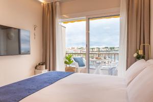 En eller flere senge i et værelse på Estudio con terraza Lorena