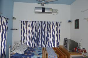 Postel nebo postele na pokoji v ubytování Aldos Ark Home Stay