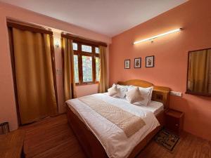 Postel nebo postele na pokoji v ubytování Hotel Geetanjali