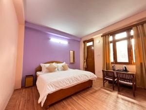 Postel nebo postele na pokoji v ubytování Hotel Geetanjali