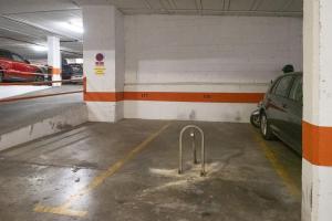 a parking garage with a car parked in it at Sanlucar Centro - Apartamento 1 in Sanlúcar de Barrameda