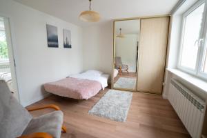 Postel nebo postele na pokoji v ubytování Apartamenty Iława - nad Małym Jeziorakiem