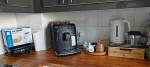 Eldhús eða eldhúskrókur á AMCP Gîte - Montgiscard
