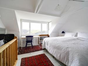 Postel nebo postele na pokoji v ubytování St Peters Cottage