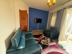 a living room with a couch and a chair at Somone houses in Somone +17 photos