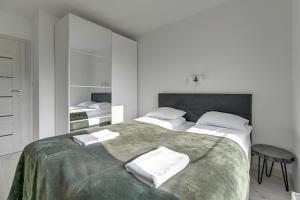 Posteľ alebo postele v izbe v ubytovaní Przystań Letnica by Comfort Apartments