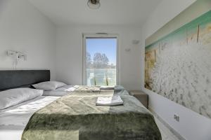 Posteľ alebo postele v izbe v ubytovaní Przystań Letnica by Comfort Apartments