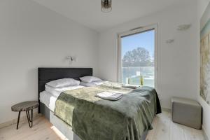 Posteľ alebo postele v izbe v ubytovaní Przystań Letnica by Comfort Apartments