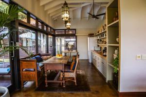 a kitchen and dining room with a table and chairs at Zimbali Emerald Eden in Ballito