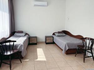 Postel nebo postele na pokoji v ubytování KAUNO JACHTKLUBAS Baltosios Burės