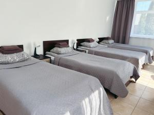 Postel nebo postele na pokoji v ubytování KAUNO JACHTKLUBAS Baltosios Burės