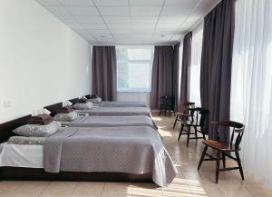 Postel nebo postele na pokoji v ubytování KAUNO JACHTKLUBAS Baltosios Burės