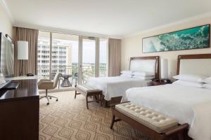 a hotel room with two beds and a balcony at JW Marriott Marco Island Beach Resort in Marco Island