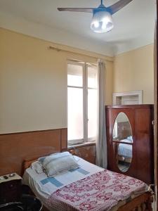 Postel nebo postele na pokoji v ubytování Triomphe Hostel