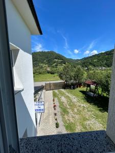 a view from the balcony of a house with a yard at Casa de vacanță Fabian in Vişeu de Jos