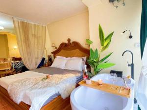 a bedroom with a bed and a bath tub at 912 Good view &2 minutes walk to one Nimman Maya in Chiang Mai