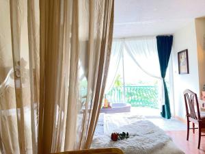 a bedroom with a bed and a large window at 912 Good view &2 minutes walk to one Nimman Maya in Chiang Mai