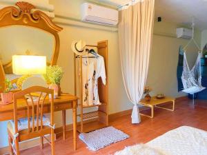 a bedroom with a table and a mirror and a desk at 912 Good view &2 minutes walk to one Nimman Maya in Chiang Mai