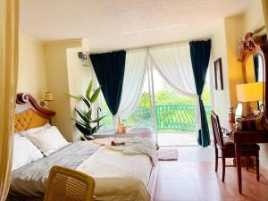 a bedroom with a bed and a large window at 912 Good view &2 minutes walk to one Nimman Maya in Chiang Mai