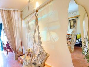 a room with two hammocks hanging from a wall at 912 Good view &2 minutes walk to one Nimman Maya in Chiang Mai