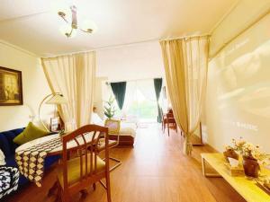 a living room with a couch and a table at 912 Good view &2 minutes walk to one Nimman Maya in Chiang Mai