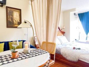 a bedroom with a bed and a table with a candle at 912 Good view &2 minutes walk to one Nimman Maya in Chiang Mai