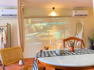 a table in a room with a picture of a bed at 912 Good view &2 minutes walk to one Nimman Maya in Chiang Mai