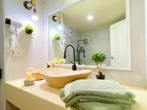 a bathroom with a sink and a large mirror at 912 Good view &2 minutes walk to one Nimman Maya in Chiang Mai
