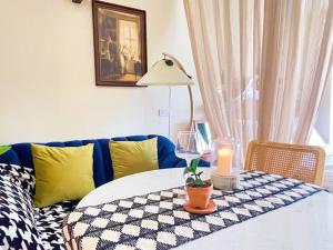 a living room with a table with a candle and a couch at 912 Good view &2 minutes walk to one Nimman Maya in Chiang Mai
