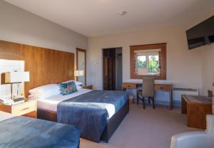 Voodi või voodid majutusasutuse Cryans Hotel toas