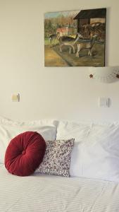 A bed or beds in a room at Guest House Pod Grebenom
