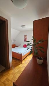 A bed or beds in a room at Guest House Pod Grebenom