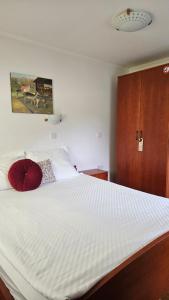 A bed or beds in a room at Guest House Pod Grebenom