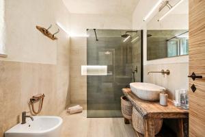 a bathroom with a sink and a shower at Fontarcella, Heart & Roots in Petrignano sul Lago