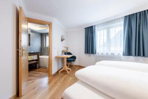 Postel nebo postele na pokoji v ubytování Hotel Jägerhof