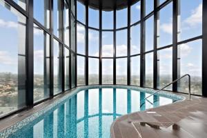 a swimming pool in the middle of a building at Brilliant 2BR Apartment in Belconnen - Hosted by Canstay in Belconnen