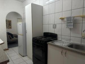 Η κουζίνα ή μικρή κουζίνα στο Busa House One bedroom Unit