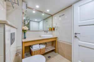 a bathroom with a sink and a mirror at Palmotta Palace in Dubrovnik