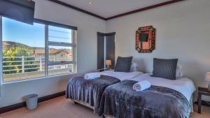 Ένα ή περισσότερα κρεβάτια σε δωμάτιο στο Trio Towers Beach View Apartment