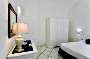 Posteľ alebo postele v izbe v ubytovaní L'Ancora Amalfi Dreams