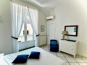 Posteľ alebo postele v izbe v ubytovaní L'Ancora Amalfi Dreams