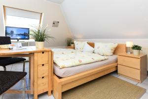 Ένα ή περισσότερα κρεβάτια σε δωμάτιο στο Apartments im Haus Friedeburg