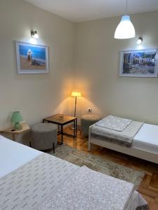 Postel nebo postele na pokoji v ubytování Apartmani Jelica FREE PARKING