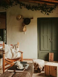 a living room with a couch and a table with cups at Estancia Palma in Tupungato