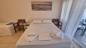 Postel nebo postele na pokoji v ubytování Ionian Dream Home