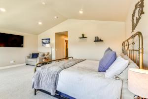 a bedroom with a bed with blue and white pillows at Park City Home with Game Room Ski, Mtn Bike and More! in Park City